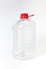 Image showing Mock-up big transparent canister for liquid on a light background.