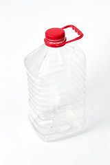 Image showing Big plastic bottle for different liquid on a light background. Mock-up.