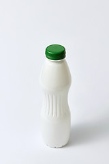 Image showing Mock up plastic white bottle for dairy on a light background.