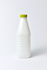 Image showing White plastic bottle for milk, mock up on a light background.