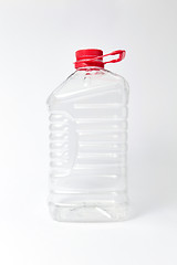 Image showing Plastic transparent canister for water on a light bakground. Mock up.