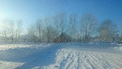 Image showing Blurred background with drops on glass