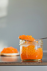 Image showing Macro shot of red caviar on jar