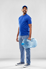 Image showing happy indian delivery man with water barrel