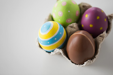 Image showing close up of chocolate and colored easter eggs