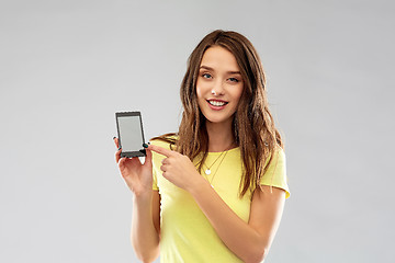 Image showing young woman or teenage girl holding smartphone