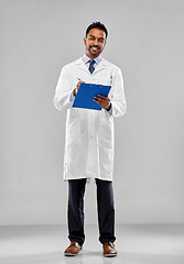 Image showing smiling indian doctor or scientist with clipboard