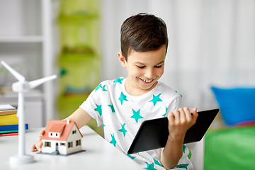 Image showing boy with tablet, toy house and wind turbine