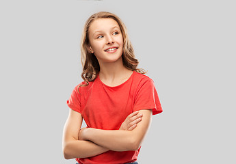 Image showing happy teenage girl in red with crossed arms