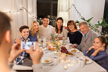 Image showing family having dinner party and taking selfie