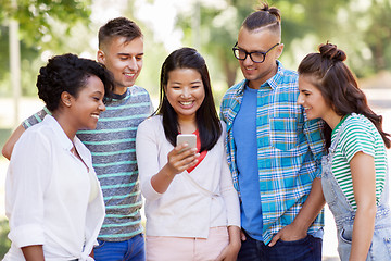 Image showing group of happy friends with smartphone outdoors