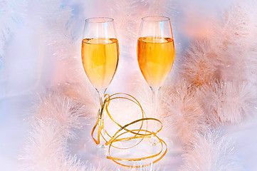 Image showing Two glasses of wine and tinsel. Holiday concept.