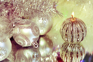 Image showing Christmas decorations with candle and silver balls.