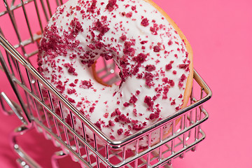 Image showing Macro shoot of donut on pink