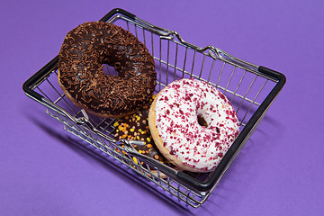 Image showing Macro shoot of donuts over purple