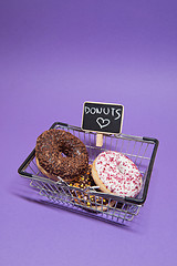 Image showing Macro shoot of donuts over purple