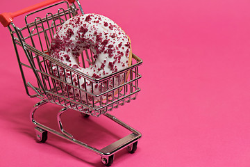 Image showing Macro shoot of donut on pink