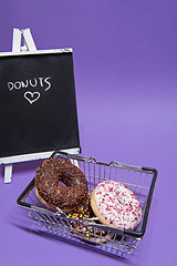 Image showing Macro shoot of donuts over purple