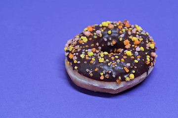 Image showing Macro shoot of donut on blue