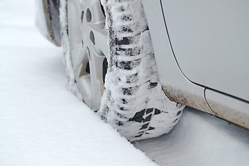 Image showing Car tyre in snow