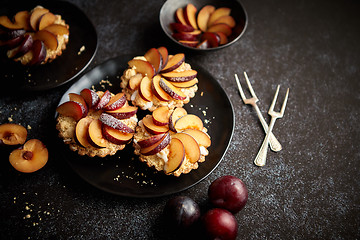 Image showing Delicious homemade mini tarts with fresh sliced plum fruit