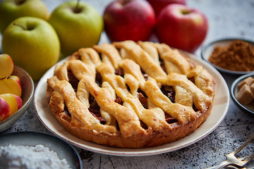 Image showing Fresh baked tasty homemade apple pie cake with ingredients on side