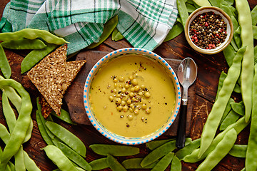 Image showing Green pea cream soup in grey bowl