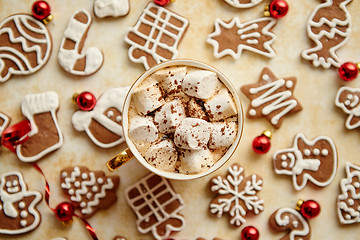 Image showing Cup of hot chocolate and Christmas shaped gingerbread cookies