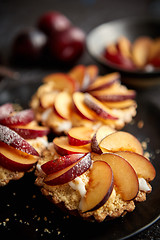 Image showing Delicious homemade mini tarts with fresh sliced plum fruit