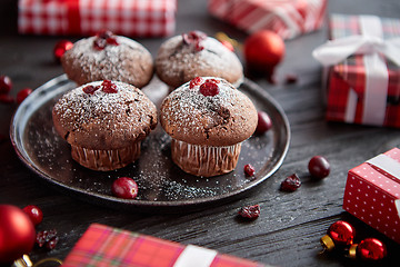 Image showing Christmas chocolate delicious muffins served on black ceramic plate