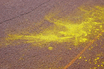 Image showing Yellow spots on brown asphalt surface