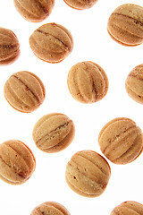 Image showing Fresh cakes walnuts pattern on a white background.