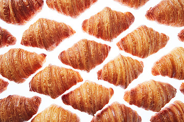 Image showing Pattern from freshly baked croissants on a white background.