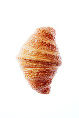 Image showing Close up french freshly baked croissant on a white background.