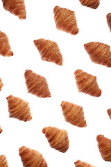 Image showing Diagonal bakery french croissants pattern on a white background.