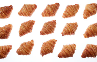 Image showing Bakery fresh croissants pattern on a white background.