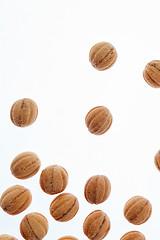 Image showing Falling homemade cookies walnuts on a white background.