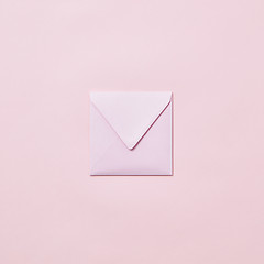 Image showing Handcraft envelope mockup for post card on a pastel pink background.