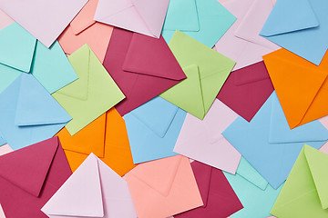 Image showing Multi colored craft envelopes pattern as a background.