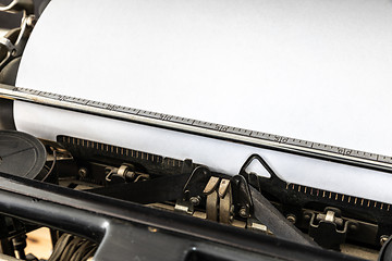 Image showing Vintage typewriter with blank sheet of paper retro technology