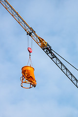 Image showing construction crane lifting concrete