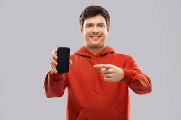 Image showing smiling man in red hoodie showing black smartphone