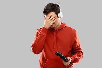 Image showing man or gamer with gamepad failed in video game