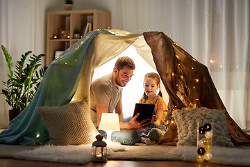 Image showing family with tablet pc in kids tent at home