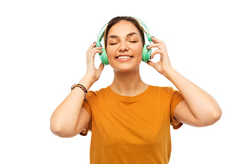 Image showing happy young woman or teenage girl with headphones