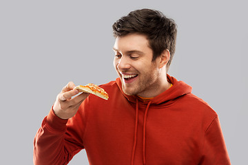 Image showing happy young man eating pizza