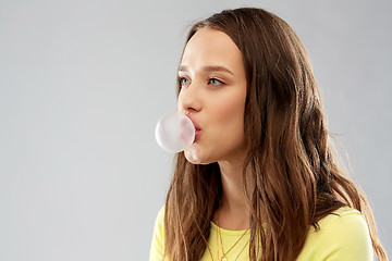 Image showing young woman or teenage girl blowing bubble gum