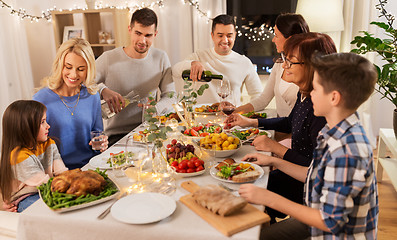 Image showing happy family having dinner party at home