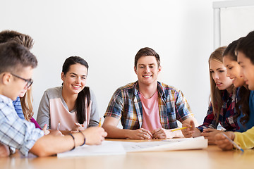 Image showing group of smiling students meeting at school