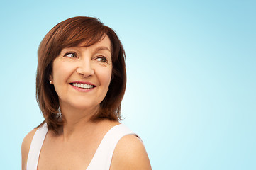 Image showing portrait of smiling senior woman over white